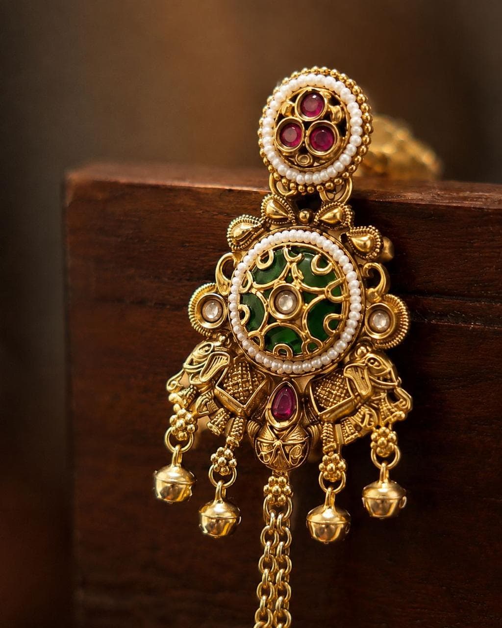 PARKA earrings — a gold and emerald temple jhumka